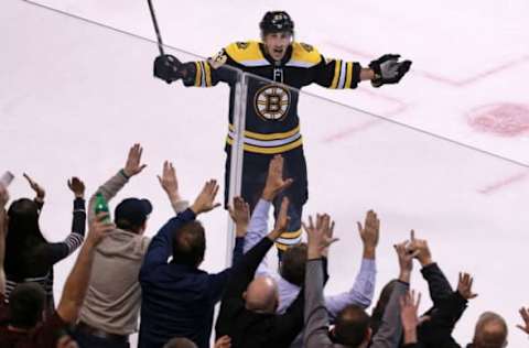 BOSTON – JANUARY 23: Boston Bruins’ Brad Marchand (63) celebrates his second period goal with fans. The Boston Bruins host the New Jersey Devils in a regular season NHL hockey game at TD Garden in Boston on Jan. 23, 2018. (Photo by Jim Davis/The Boston Globe via Getty Images)