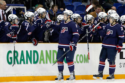 SASKATOON, SK – JANUARY 3: John Carlson #11 and Jeremy Morin #26 of Team USA celebrate a goal with team mates during the 2010 IIHF World Junior Championship Tournament Semifinal game against Team Sweden on January 3, 2010 at the Credit Union Centre in Saskatoon, Saskatchewan, Canada. Team USA defeated Team Sweden 5-2. (Photo by Richard Wolowicz/Getty Images)