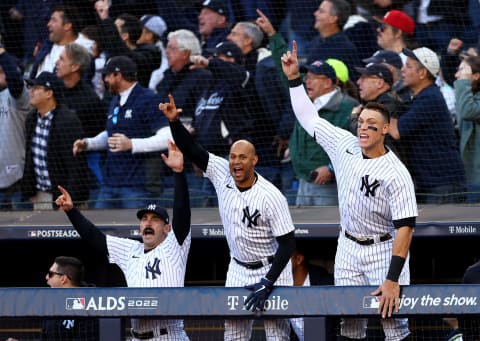 NEW YORK, NEW YORK – OCTOBER 18: Matt Carpenter #24, Aaron Hicks #31 and Aaron Judge #99 of the New York Yankees react to Giancarlo Stanton #27 three-run home run against the Cleveland Guardians during the first inning in game five of the American League Division Series at Yankee Stadium on October 18, 2022 the Bronx borough of New York City. (Photo by Elsa/Getty Images)