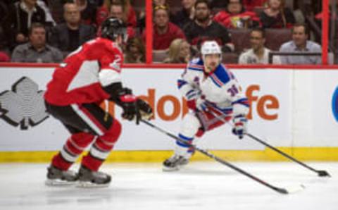 Apr 27, 2017; Ottawa, Ontario, CAN; New York Rangers right wint Mats Zuccarello (36) skates with the puck with Ottawa Senators defenseman Dion Phaneuf (2) defending (Marc DesRosiers-USA TODAY Sports)