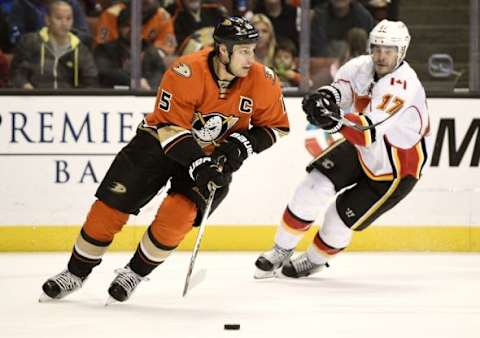 Feb 21, 2016; Anaheim, CA, USA; Anaheim Ducks center Ryan Getzlaf (15) moves the puck in front of Calgary Flames left wing Lance Bouma (17) during the third period at Honda Center. The Anaheim Ducks won 5-2. Mandatory Credit: Kelvin Kuo-USA TODAY Sports