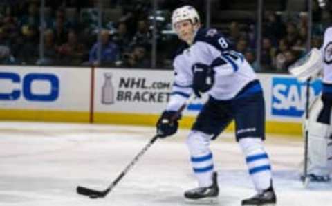 Apr 7, 2016; San Jose, CA, USA; Winnipeg Jets defenseman Jacob Trouba (8) looks to pass against the San Jose Sharks in the second period at SAP Center at San Jose. Winnipeg won 5-4. Mandatory Credit: John Hefti-USA TODAY Sports