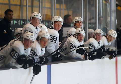 BOSTON – JUNE 28: Players on the bench watch the action during a scrimmage on Day 3 of a Boston Bruins development camp at Warrior Ice Arena in the Brighton neighborhood of Boston on June 28, 2019. (Photo by John Tlumacki/The Boston Globe via Getty Images)