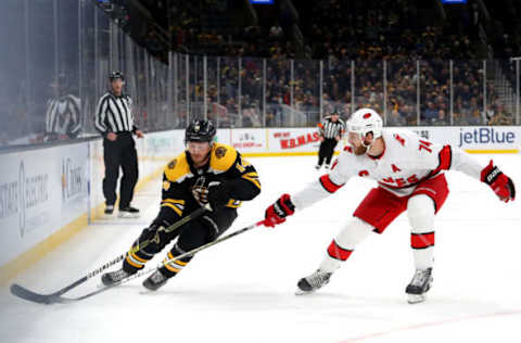 BOSTON, MASSACHUSETTS – DECEMBER 03: Jaccob Slavin #74 of the Carolina Hurricanes defends Chris Wagner #14 of the Boston Bruins during the first period at TD Garden on December 03, 2019 in Boston, Massachusetts. (Photo by Maddie Meyer/Getty Images)