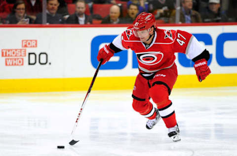 RALEIGH, NC – APRIL 04: Marc-Andre Bergeron #47 of the Carolina Hurricanes moves the puck against his former team, the Tampa Bay Lightning, during play at PNC Arena on April 4, 2013 in Raleigh, North Carolina. (Photo by Grant Halverson/Getty Images)