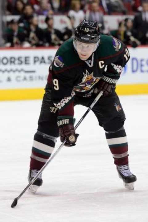 Mar 5, 2015; Glendale, AZ, USA; Arizona Coyotes right wing Shane Doan (19) lines up for a faceoff against the Vancouver Canucks at Gila River Arena. The Coyotes won 3-2 in a shootout. Mandatory Credit: Joe Camporeale-USA TODAY Sports