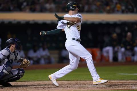 Aug 27, 2021; Oakland, California, USA; Oakland Athletics first baseman Matt Olson (28) hits an RBI single against the New York Yankees in the seventh inning at RingCentral Coliseum. Mandatory Credit: Cary Edmondson-USA TODAY Sports