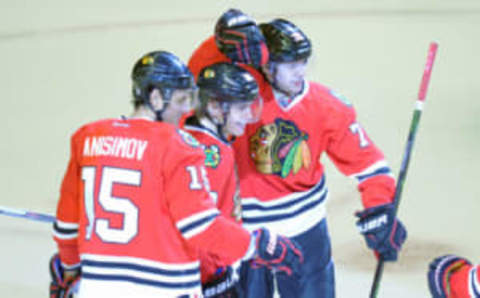 Chicago Blackhawks left wing Artemi Panarin (72) celebrates with right wing Patrick Kane (88) and center Artem Anisimov (15) (Patrick Gorski-USA TODAY Sports)