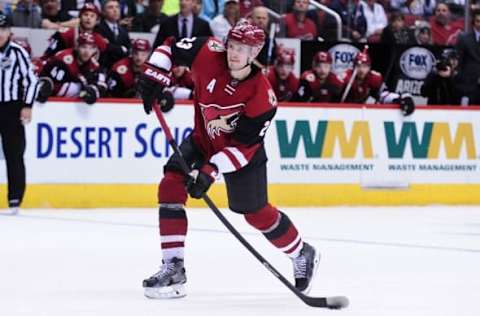 Feb 15, 2016; Glendale, AZ, USA; Arizona Coyotes defenseman Oliver Ekman-Larsson (23) shoots and scores a goal in the second period against the Montreal Canadiens at Gila River Arena. Mandatory Credit: Matt Kartozian-USA TODAY Sports