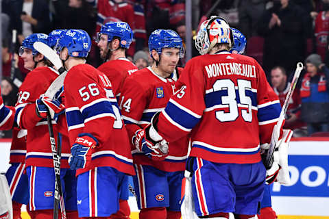 MONTREAL, CANADA – MARCH 25: Nick Suzuki #14 of the Montreal Canadiens and goaltender Sam Montembeault #35 celebrate their victory against the Columbus Blue Jackets at Centre Bell on March 25, 2023 in Montreal, Quebec, Canada. The Montreal Canadiens defeated the Columbus Blue Jackets 8-2. (Photo by Minas Panagiotakis/Getty Images)