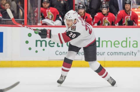 Oct 18, 2016; Ottawa, Ontario, CAN; Arizona Coyotes center Dylan Strome (20) shoots the puck to mark his first NHL point on an assist in the first period against the Ottawa Senators at Canadian Tire Centre. Mandatory Credit: Marc DesRosiers-USA TODAY Sports