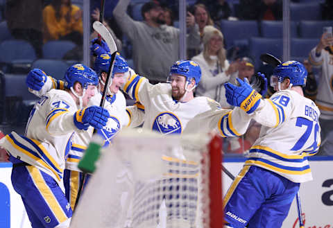 Mar 25, 2022; Buffalo, New York, USA; Buffalo Sabres left wing Victor Olofsson (71) celebrates his goal with teammates during the second period against the Washington Capitals at KeyBank Center. Mandatory Credit: Timothy T. Ludwig-USA TODAY Sports