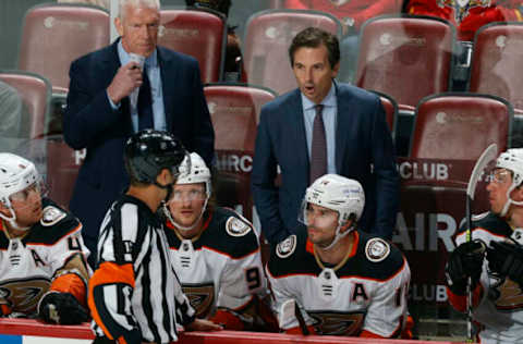 SUNRISE, FL – APRIL 12: Referee Jean Herbert #15 talks to head coach Dallas Eakins of the Anaheim Ducks during a break in the action against the Florida Panthers at the FLA Live Arena on April 12, 2022 in Sunrise, Florida. (Photo by Joel Auerbach/Getty Images)