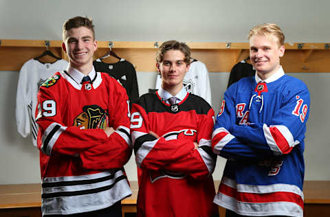 VANCOUVER, BRITISH COLUMBIA – JUNE 21: (L-R) Kirby Dach, third overall pick by the Chicago Blackhawks, Jack Hughes, first overall pick by the New Jersey Devils, and Kaapo Kakko, second overall pick by the New York Rangers, pose for group photo during the first round of the 2019 NHL Draft at Rogers Arena on June 21, 2019 in Vancouver, Canada. (Photo by Andre Ringuette/NHLI via Getty Images)