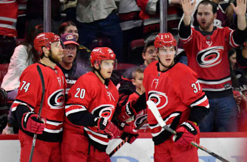 RALEIGH, NORTH CAROLINA – FEBRUARY 25: Sebastian Aho #20 of the Carolina Hurricanes celebrates with teammates after scoring a goal against the Dallas Stars during the second period at PNC Arena on February 25, 2020 in Raleigh, North Carolina. (Photo by Grant Halverson/Getty Images)