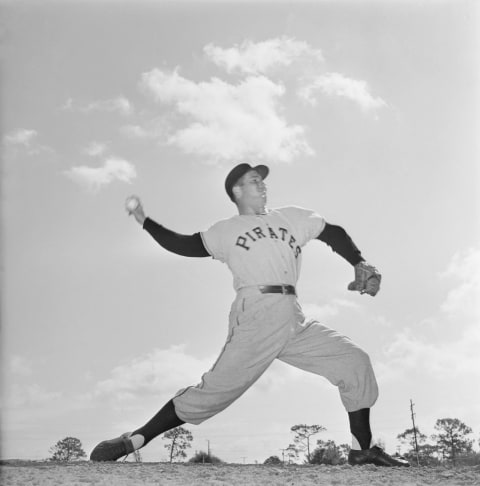 (Original Caption) Bob Friend, who won 14 and lost 9 last year and was one of outstanding National League pitchers for the Pittsburgh Pirates, is silhouetted in action against the Florida sky as he works out here.