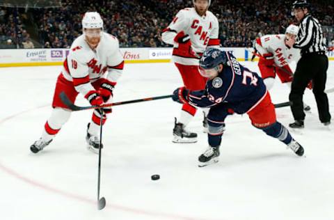 COLUMBUS, OH – JANUARY 16: Dougie Hamilton #19 of the Carolina Hurricanes and Nathan Gerbe #24 of the Columbus Blue Jackets battle for control of the puck during the game on January 16, 2020 at Nationwide Arena in Columbus, Ohio. (Photo by Kirk Irwin/Getty Images)