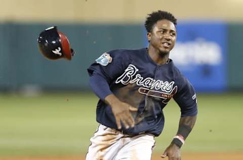 Mar 12, 2016; Lake Buena Vista, FL, USA; Atlanta Braves shortstop Ozzie Albies (87) loses his helmet whole running to third base during the sixth inning of a spring training baseball game against the Washington Nationals at Champion Stadium. Mandatory Credit: Reinhold Matay-USA TODAY Sports