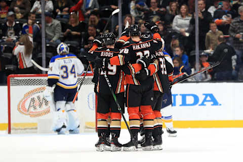 ANAHEIM, CALIFORNIA – MARCH 11: Christian Djoos #29 and Jakob Silfverberg #33 congratulate Jani Hakanpaa #28 of the Anaheim Ducks after he scored his first NHL goal as Jake Allen #34 of the St. Louis Blues looks on during the second period of a game at Honda Center on March 11, 2020 in Anaheim, California. (Photo by Sean M. Haffey/Getty Images)