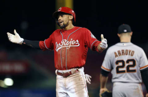 May 5, 2017; Cincinnati, OH, USA; Cincinnati Reds center fielder Billy Hamilton (left) reacts at third next to San Francisco Giants third baseman Christian Arroyo (22) after hitting a triple during the sixth inning at Great American Ball Park. Mandatory Credit: David Kohl-USA TODAY Sports