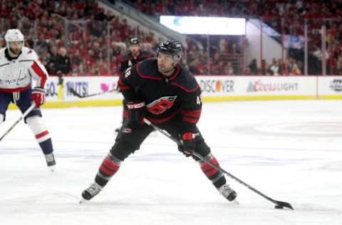 RALEIGH, NC – APRIL 18: Jordan Martinook #48 of the Carolina Hurricanes controls the puck on the ice in Game Four of the Eastern Conference First Round against the Washington Capitals during the 2019 NHL Stanley Cup Playoffs on April 18, 2019 at PNC Arena in Raleigh, North Carolina. (Photo by Gregg Forwerck/NHLI via Getty Images)