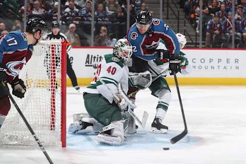 DENVER, CO – JANUARY 06: Colin Wilson #22 of the Colorado Avalanche handles the puck infront of goaltender Devan Dubnyk #40 of the Minnesota Wild at the Pepsi Center on January 6, 2018 in Denver, Colorado. The Avalanche defeated the Wild 7-2. (Photo by Michael Martin/NHLI via Getty Images)