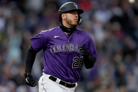 DENVER, COLORADO – APRIL 16: C.J. Cron #25 of the Colorado Rockies circles the bases after hitting a 3 RBI home run against the Chicago Cubs in the third inning at Coors Field on April 16, 2022 in Denver, Colorado. (Photo by Matthew Stockman/Getty Images)