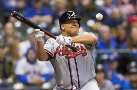 Apr 28, 2017; Milwaukee, WI, USA; Atlanta Braves pitcher Bartolo Colon (40) bunts during the third inning against the Milwaukee Brewers at Miller Park. Mandatory Credit: Jeff Hanisch-USA TODAY Sports