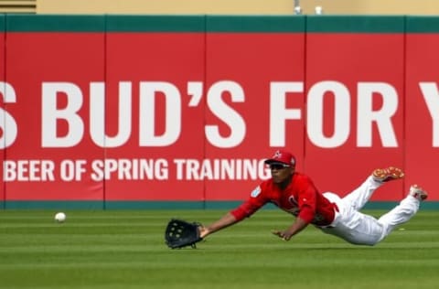 Mar 21, 2016; Jupiter, FL, USA; St. Louis Cardinals center fielder Magnneuris Sierra (98) makes a diving attempt against the Boston Red Sox during the game at Roger Dean Stadium. The Red Sox defeated the Cardinals 4-3. Mandatory Credit: Scott Rovak-USA TODAY Sports