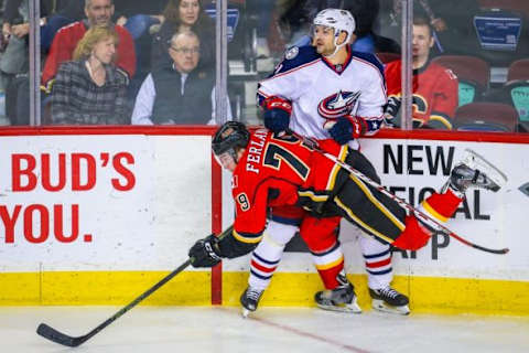 Feb 5, 2016; Calgary, Alberta, CAN; Calgary Flames left wing Micheal Ferland (79) and Columbus Blue Jackets defenseman Fedor Tyutin (51) collide during the second period at Scotiabank Saddledome. Columbus Blue Jackets won 2-1. Mandatory Credit: Sergei Belski-USA TODAY Sports