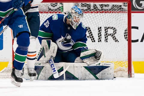 VANCOUVER, BC – MARCH 13: Goalie Thatcher Demko #35 of the Vancouver Canucks makes a save during NHL action against the Edmonton Oilers at Rogers Arena on March 13, 2021 in Vancouver, Canada. (Photo by Rich Lam/Getty Images)