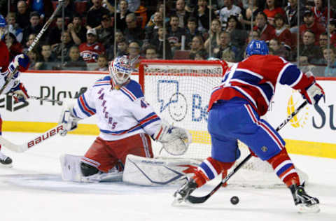 MONTREAL, CANADA – FEBRUARY 5: Scott Gomez #11 of the Montreal Canadiens shoots the puck to score on Martin Biron #43 of the New York Rangers during the NHL game at the Bell Centre on February 5, 2011, in Montreal, Quebec, Canada. (Photo by Richard Wolowicz/Getty Images)