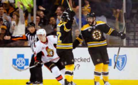 Apr 6, 2017; Boston, MA, USA; Boston Bruins right wing Drew Stafford (19) celebrates his goal with center Frank Vatrano (72) as Ottawa Senators center Jean-Gabriel Pageau (44) skates away during the first period at TD Garden. Mandatory Credit: Winslow Townson-USA TODAY Sports