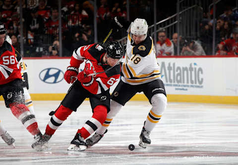 Jesper Bratt of the New Jersey Devils and Pavel Zacha of the Boston Bruins. (Photo by Bruce Bennett/Getty Images)