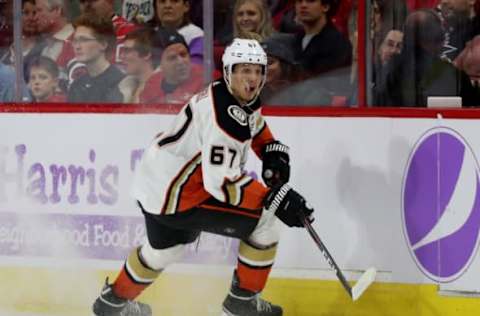 RALEIGH, NC – NOVEMBER 30: Richard Rakell #67 of the Anaheim Ducks controls the puck along the boards during an NHL game against the Carolina Hurricanes on November 30, 2018, at PNC Arena in Raleigh, North Carolina. (Photo by Gregg Forwerck/NHLI via Getty Images)