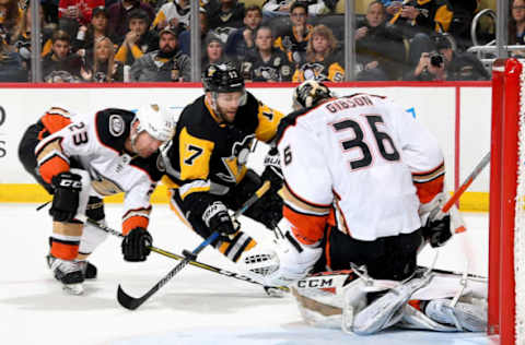 PITTSBURGH, PA: John Gibson #36 of the Anaheim Ducks makes a save on Bryan Rust #17 of the Pittsburgh Penguins on December 23, 2017. (Photo by Joe Sargent/NHLI via Getty Images)