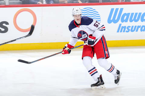 WINNIPEG, MB – FEBRUARY 26: Tyler Myers #57 of the Winnipeg Jets keeps an eye on the play during third period action against the Minnesota Wild at the Bell MTS Place on February 26, 2019 in Winnipeg, Manitoba, Canada. The Wild defeated the Jets 3-2. (Photo by Jonathan Kozub/NHLI via Getty Images)