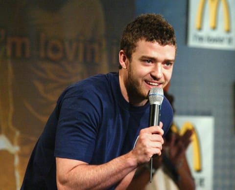 Justin Timberlake speaks on stage at the McDonalds launch of their Sony Big Mac Meal tracks promotion in 2004.