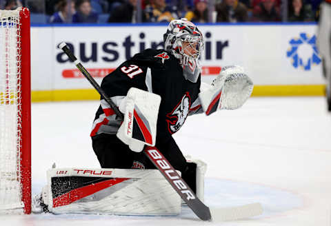 Mar 4, 2023; Buffalo, New York, USA; Buffalo Sabres goaltender Eric Comrie (31) looks for the puck during the first period against the Tampa Bay Lightning at KeyBank Center. Mandatory Credit: Timothy T. Ludwig-USA TODAY Sports