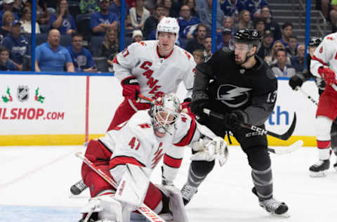 TAMPA, FL – NOVEMBER 30: Cedric Paquette #13 of the Tampa Bay Lightning skates against goalie James Reimer #47 of the Carolina Hurricanes during the first period at Amalie Arena on November 30, 2019 in Tampa, Florida. (Photo by Scott Audette /NHLI via Getty Images)