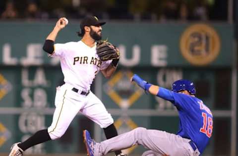 Sep 28, 2016; Pittsburgh, PA, USA; Pittsburgh Pirates shortstop baseman Sean Rodriguez (3) turns a double play over Chicago Cubs second baseman Ben Zobrist (18) during the fourth inning at PNC Park. Mandatory Credit: Charles LeClaire-USA TODAY Sports