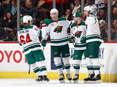 VANCOUVER, BC – DECEMBER 4: Jason Zucker #16 of the Minnesota Wild is congratulated by teammates Mikael Granlund #64, Charlie Coyle #3 and Eric Staal #12 after scoring during their NHL game against the Vancouver Canucks at Rogers Arena December 4, 2018 in Vancouver, British Columbia, Canada. The Wild won 3-2. (Photo by Jeff Vinnick/NHLI via Getty Images)