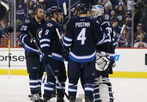 NHL Power Rankings: Winnipeg Jets goalie Connor Hellebuyck (37) celebrates with teammates after defeating the the Colorado Avalanche 4-1 at MTS Centre. Mandatory Credit: Bruce Fedyck-USA TODAY Sports