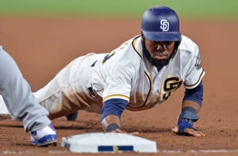 Sep 28, 2016; San Diego, CA, USA; San Diego Padres center fielder Mannuel Margot (70) dives back to first during the seventh inning against the Los Angeles Dodgers at Petco Park. Mandatory Credit: Jake Roth-USA TODAY Sports