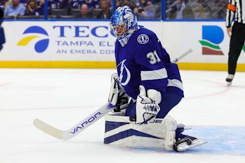 Sep 29, 2023; Tampa, Florida, USA; Tampa Bay Lightning goaltender Jonas Johansson (31) makes a save against the Carolina Hurricanes in the first period during preseason at Amalie Arena. Mandatory Credit: Nathan Ray Seebeck-USA TODAY Sports