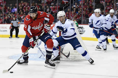 WASHINGTON, DC – MARCH 20: Tom Wilson #43 of the Washington Capitals controls the puck against Mikhail Sergachev #98 of the Tampa Bay Lightning in the first period at Capital One Arena on March 20, 2019 in Washington, DC. (Photo by Patrick McDermott/NHLI via Getty Images)