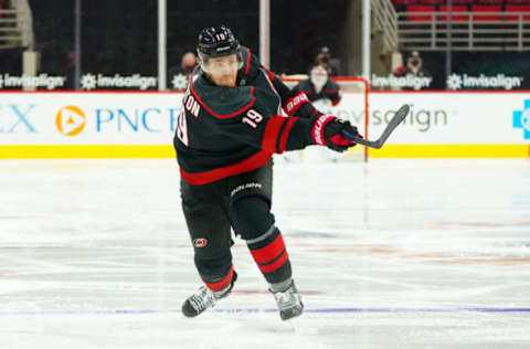 Feb 17, 2021; Raleigh, North Carolina, USA; Carolina Hurricanes defenseman Dougie Hamilton (19) takes a shot against the Florida Panthers at PNC Arena. Mandatory Credit: James Guillory-USA TODAY Sports