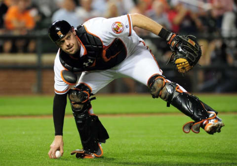 Sep 21, 2016; Baltimore, MD, USA; Baltimore Orioles catcher Matt Wieters (32) fields a ground ball in the sixth inning against the Boston Red Sox at Oriole Park at Camden Yards. Mandatory Credit: Evan Habeeb-USA TODAY Sports