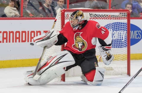 Nov 1, 2016; Ottawa, Ontario, CAN; Ottawa Senators goalie Craig Anderson (41) makes a save in the first period against the Carolina Hurricanes at Canadian Tire Centre. Mandatory Credit: Marc DesRosiers-USA TODAY Sports