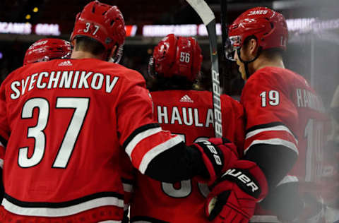 RALEIGH, NC – OCTOBER 6: Erik Haula #56 of the Carolina Hurricanes celebrates after scoring a goal with teammates Andrei Svechnikov #37 and Dougie Hamilton #19 during an NHL game against the Tampa Bay Lightning on October 6, 2019 at PNC Arena in Raleigh North Carolina. (Photo by Gregg Forwerck/NHLI via Getty Images)